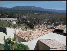 The Luberon hills behind the rooves of Cucuron